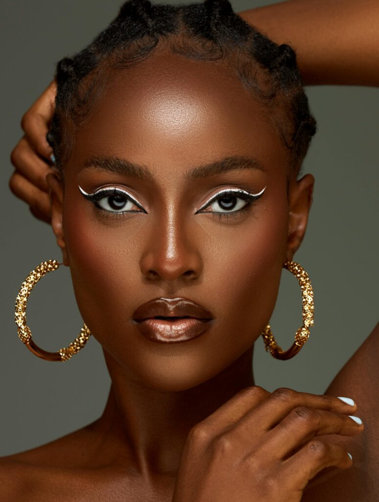 Portrait of Beautiful Woman with Makeup and Golden Earrings